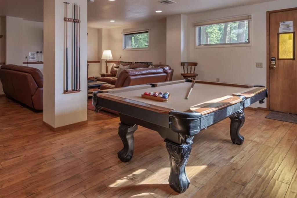 a living room with a pool table in it at Runnymeade Cottage in Kings Beach