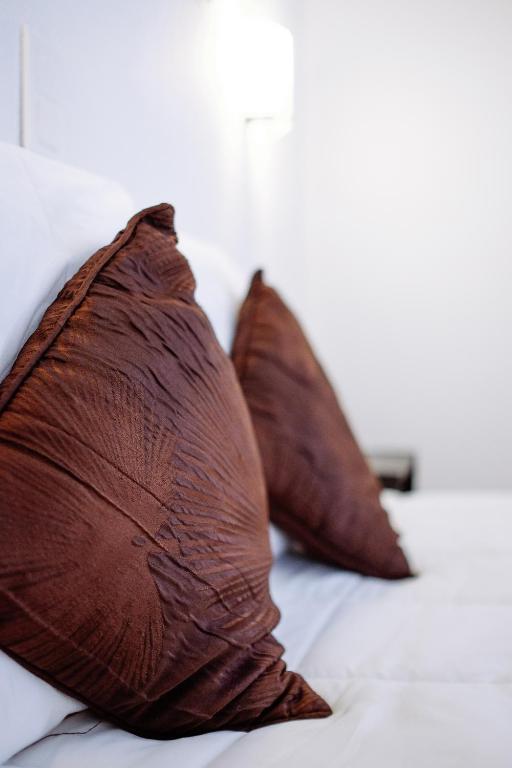 Postel nebo postele na pokoji v ubytování Hôtel Pedussaut