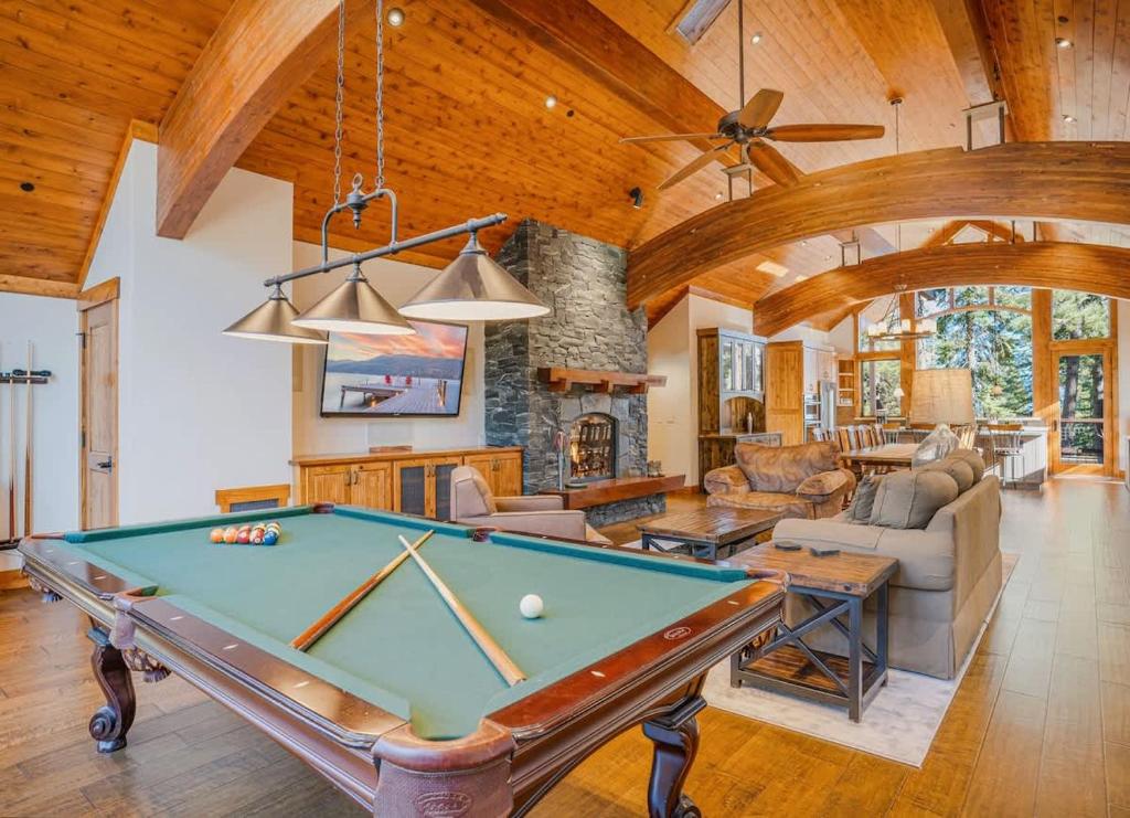 a living room with a pool table in it at Stone Peak Lodge in Tahoe City