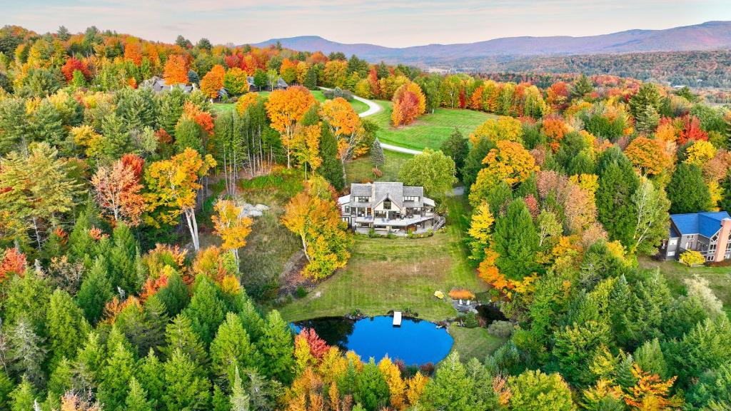 an aerial view of a home in the autumn foliage at Weeks Hill Meadows in Stowe