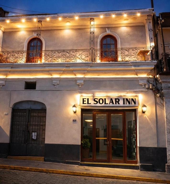 a building with a sign that reads el solar inn at El Solar Inn in Arequipa