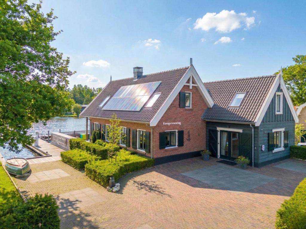 an aerial view of a house with a solar roof at Villa Kaagervaaring in Kaag