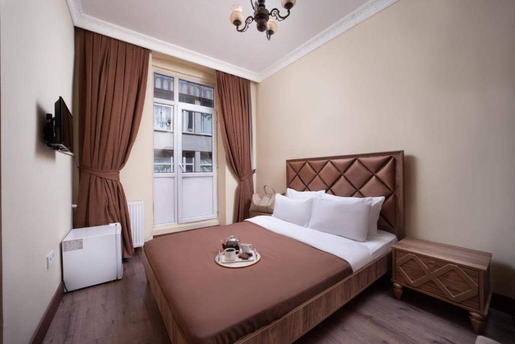 a hotel room with a bed and a window at Taxim in Istanbul