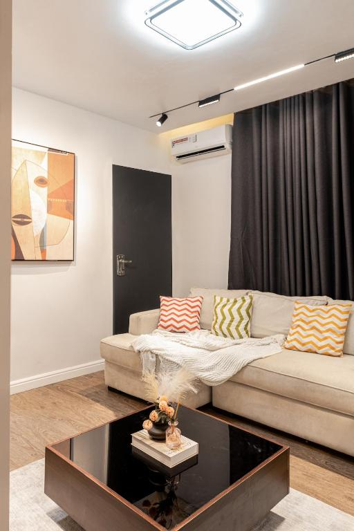a living room with a couch and a coffee table at Aiidraproperties in Lagos