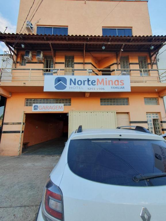 a car parked in front of a building at Norte Minas Hotel in Bocaiúva