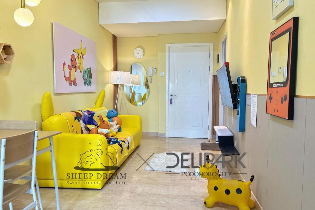 a yellow living room with a yellow couch and a yellow chair at SheepDream 7DI DeliparkMall 2Bedroom, 1Bathroom in Medan