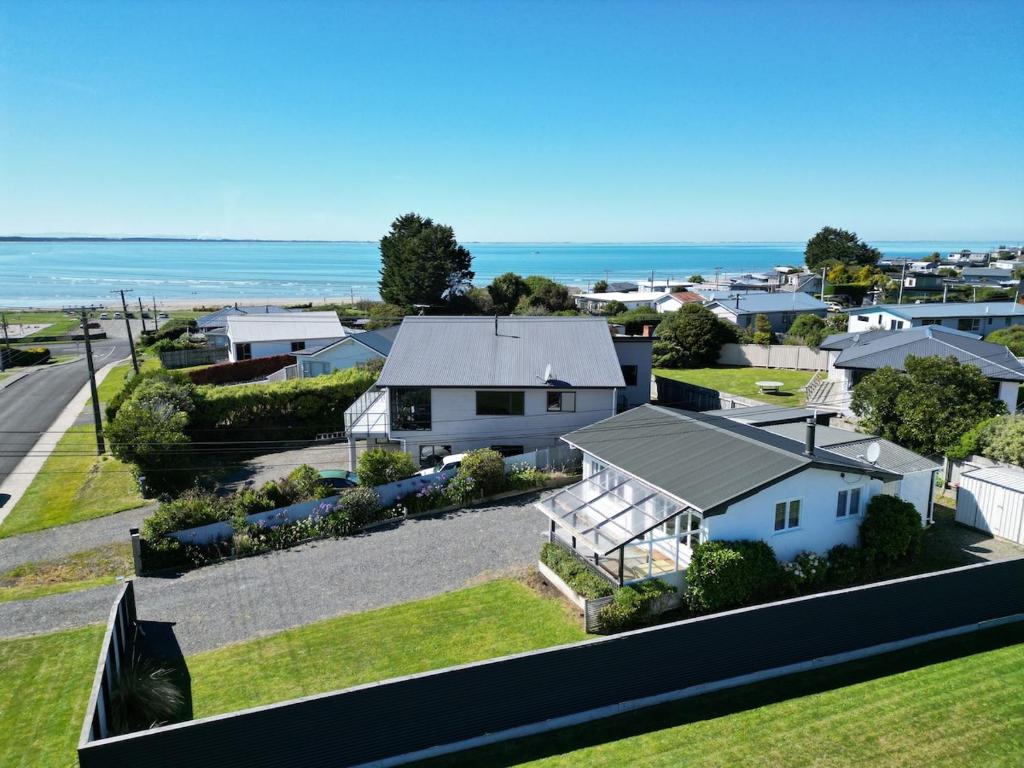 an aerial view of a house with the ocean in the background at Wilmas by the Bay in Riverton