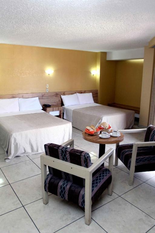 Postel nebo postele na pokoji v ubytování Hotel Universo