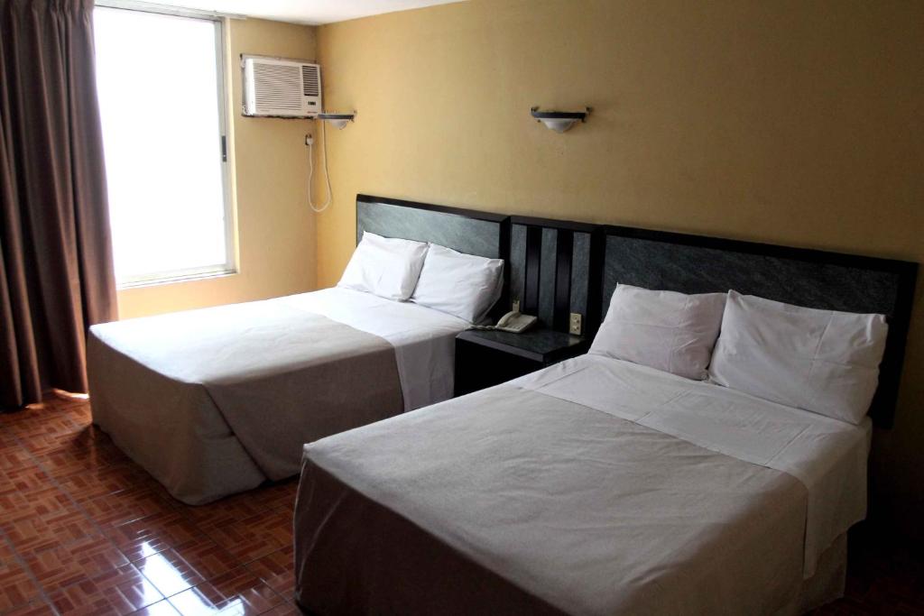 Postel nebo postele na pokoji v ubytování Hotel Universo