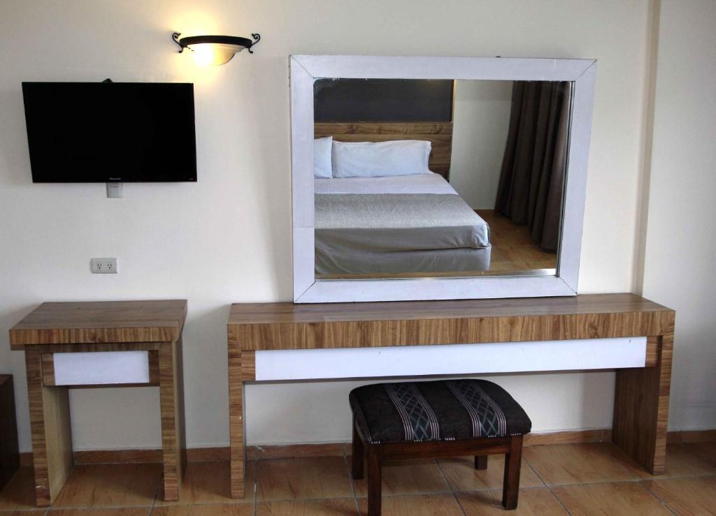 Postel nebo postele na pokoji v ubytování Hotel Universo