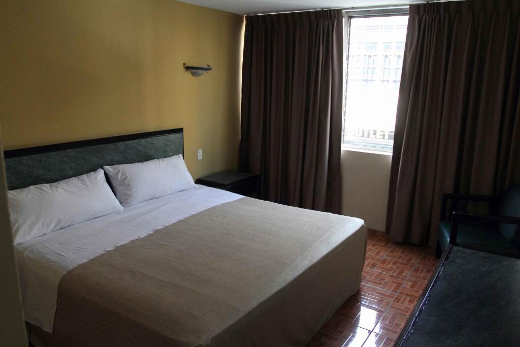 Postel nebo postele na pokoji v ubytování Hotel Universo