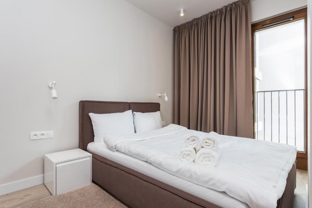 Posteľ alebo postele v izbe v ubytovaní Platinum Residence Mokotów
