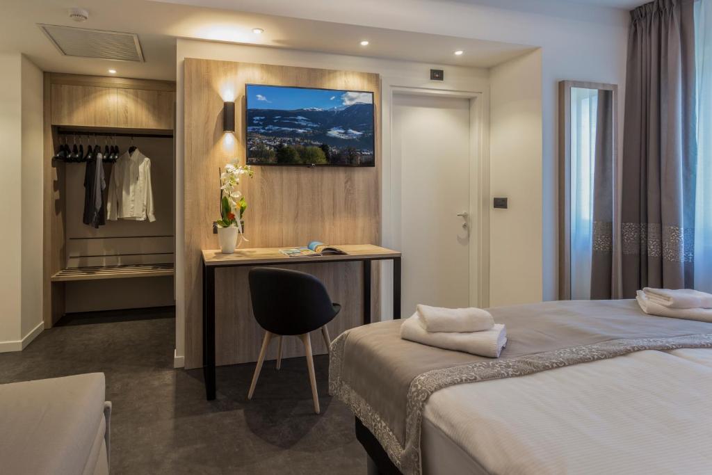 Postel nebo postele na pokoji v ubytování Tourist Hotel