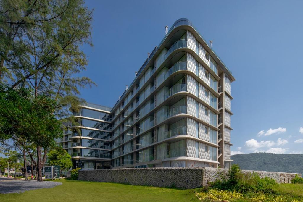 an apartment building with a dome at Andaman Riviera in Bang Tao Beach