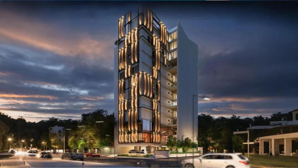 a rendering of a building with cars parked in a parking lot at Monsoon Courtyard Luxury Hotel in Dhaka