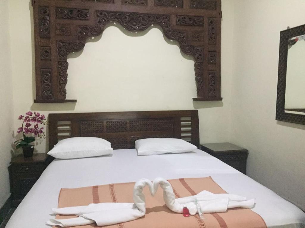 Postel nebo postele na pokoji v ubytování Pamularsih Homestay