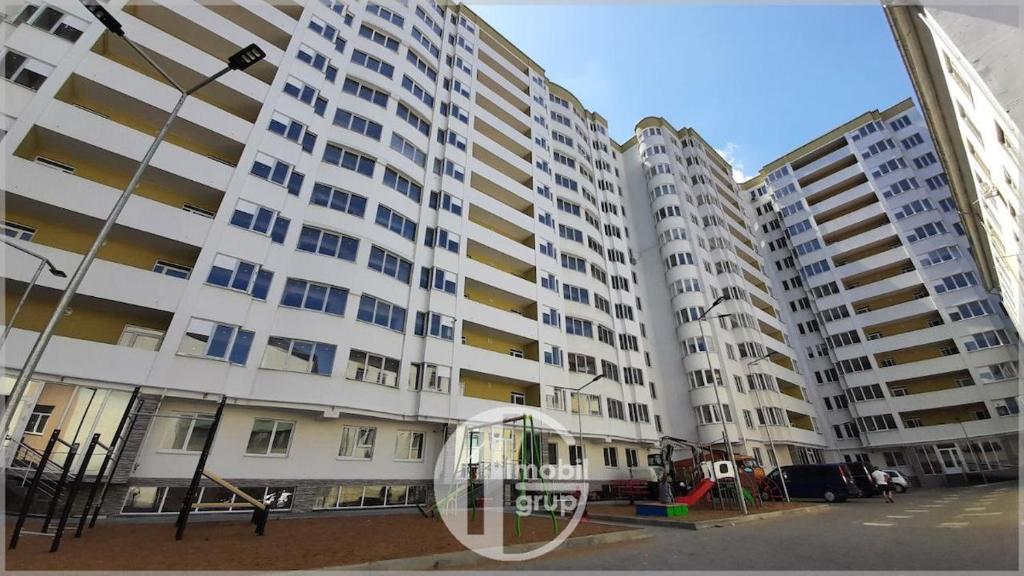 two tall white buildings with a gazebo in front of them at Fine Boutique Apartment in Chişinău