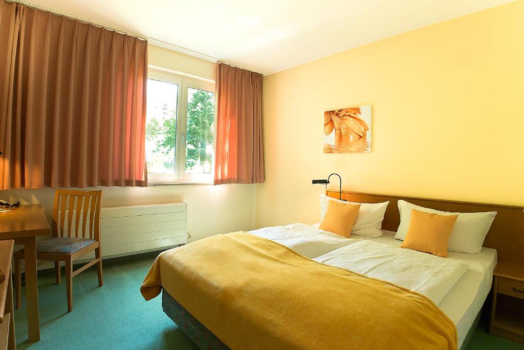 Voodi või voodid majutusasutuse Apart Hotel Gera toas
