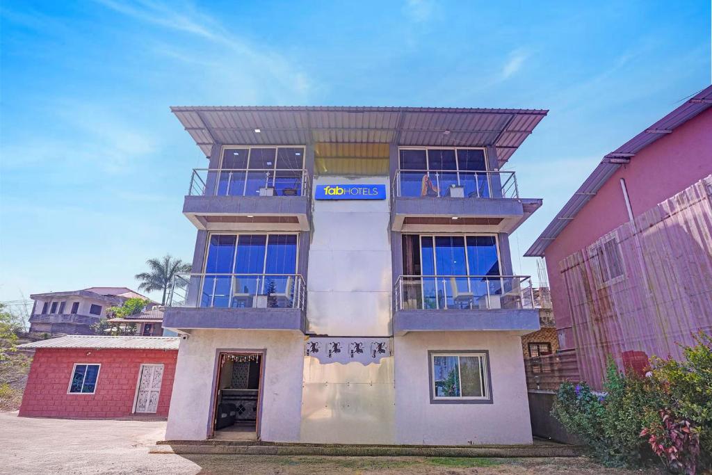 a building with a roof on top of it at FabHotel Aaryras Heritage Resort in Mahabaleshwar