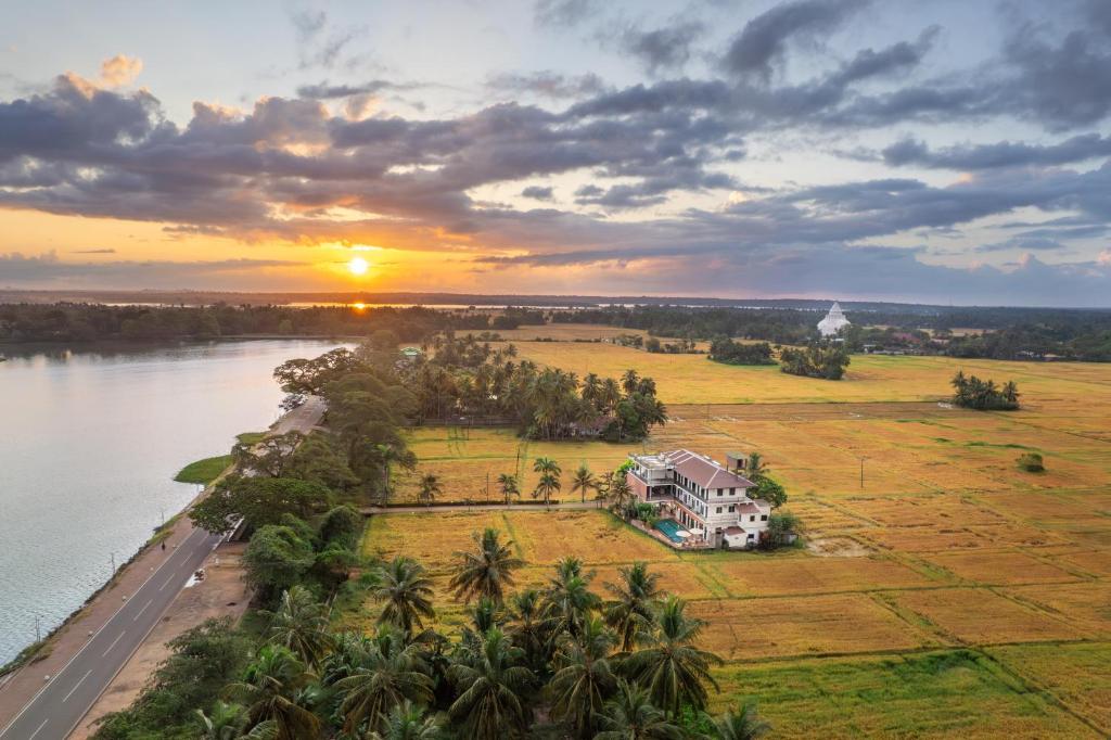 an aerial view of a house next to the water at Serene Park Hotel By Ark in Tissamaharama