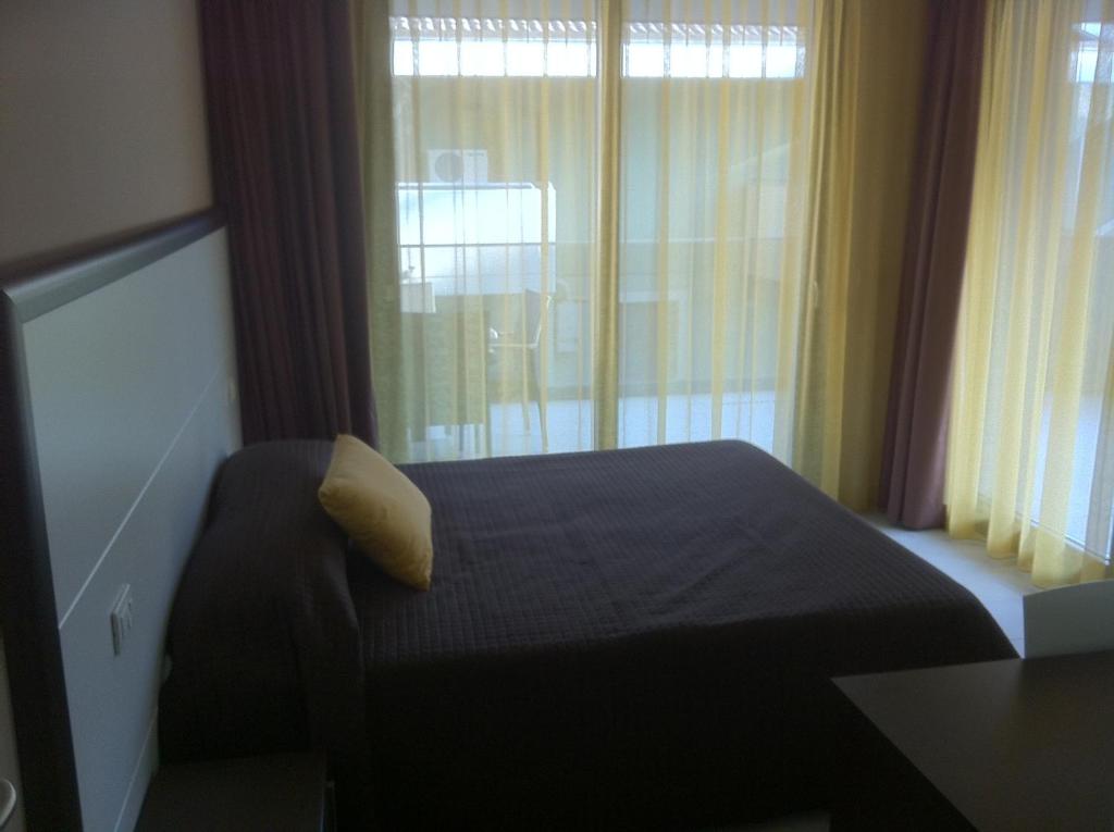 Postel nebo postele na pokoji v ubytování Residence Ormeggio