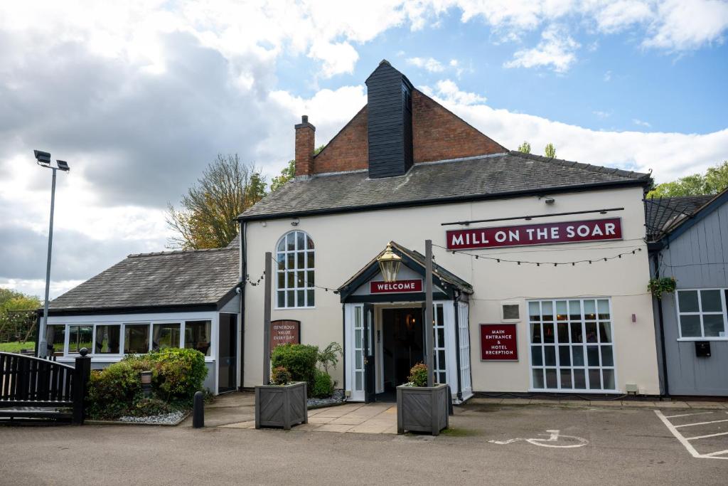 a building with a sign that reads mill on the soap at Mill On The Soar by Greene King Inns in Broughton Astley