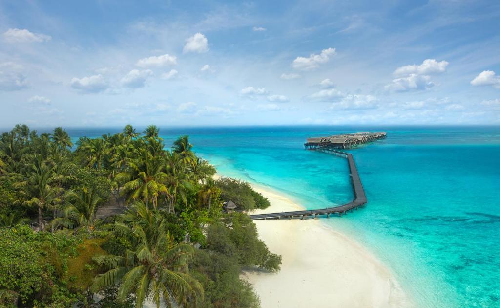 an aerial view of a beach with palm trees and the ocean at Adaaran Select Huduran Fushi - Free Dine around Premium All Inclusive 24 hours - 30 mins by Speedboat in Hudhuranfushi