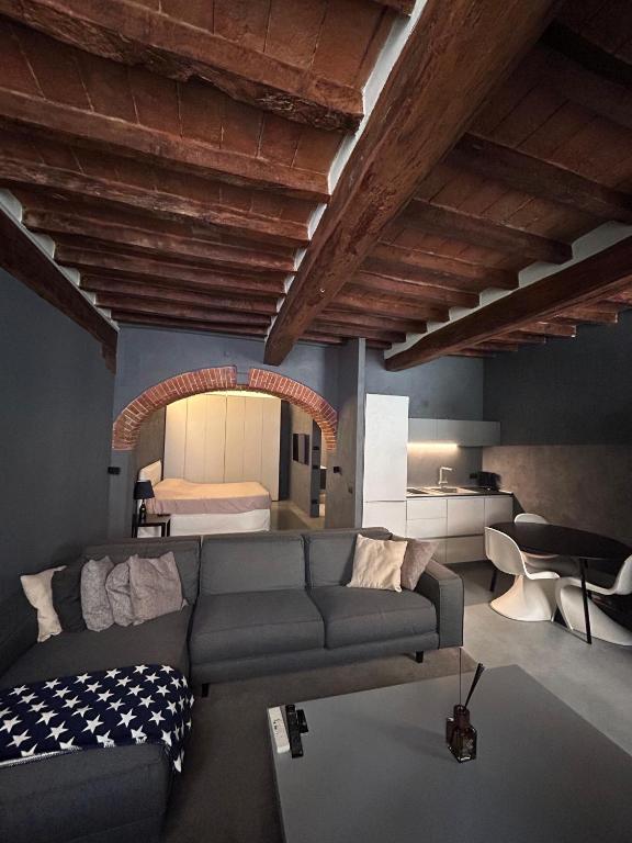 a living room with a couch and a bed at G11 Carpi in Carpi