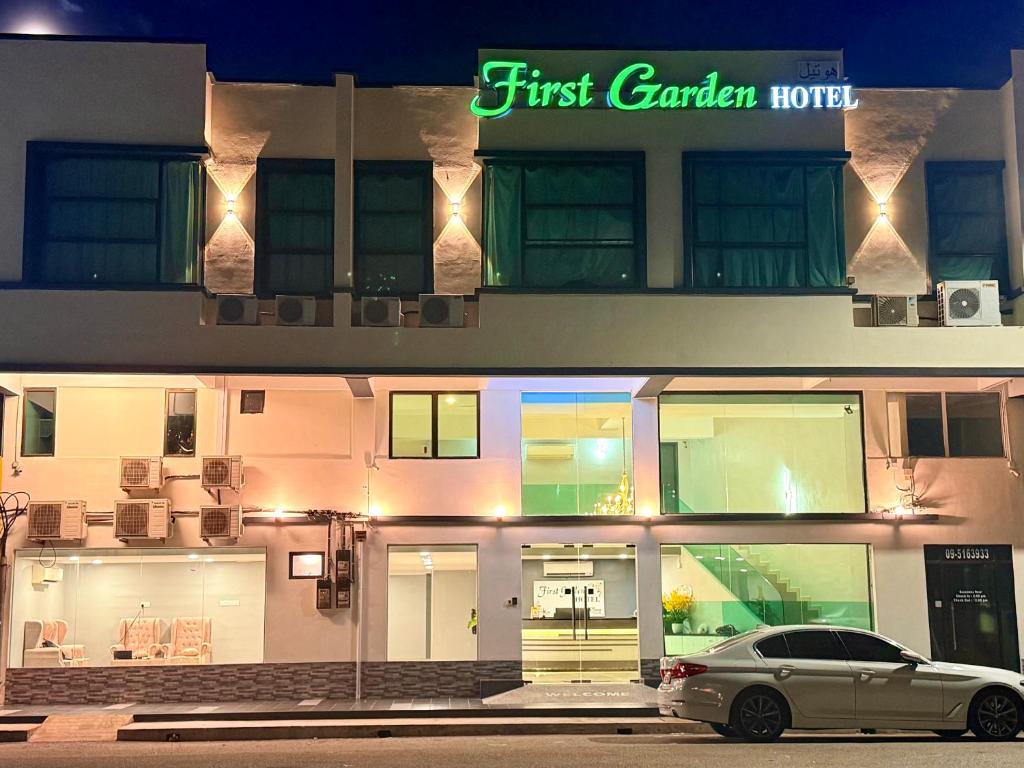 a car parked in front of a first garden hotel at Hotel first garden in Kuantan