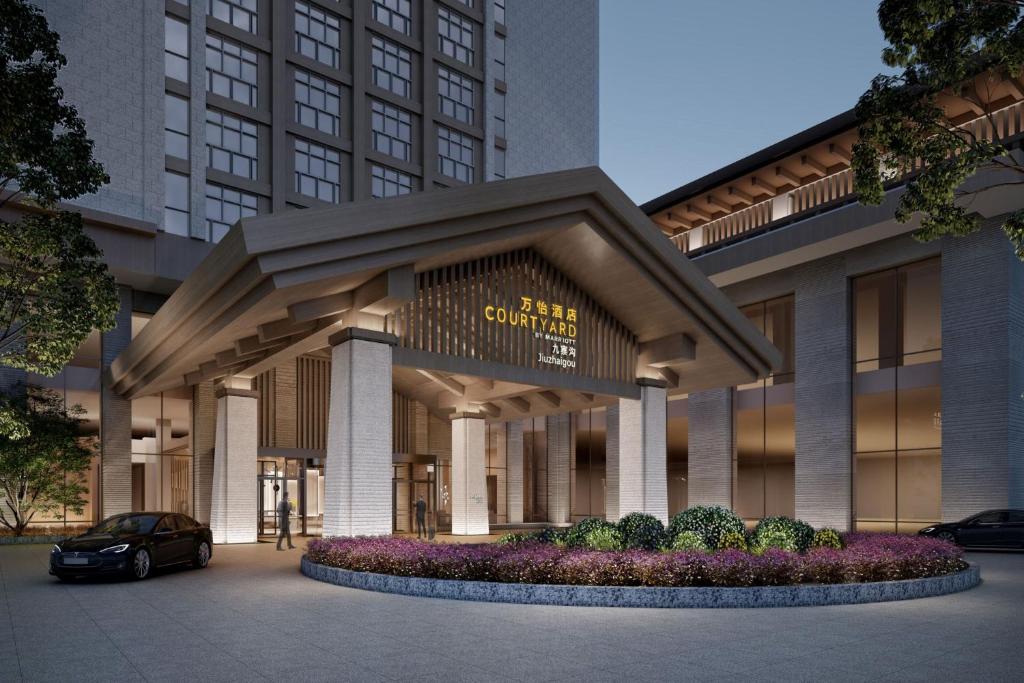 a rendering of a building with a car parked in front at Courtyard by Marriott Jiuzhaigou in Jiuzhaigou