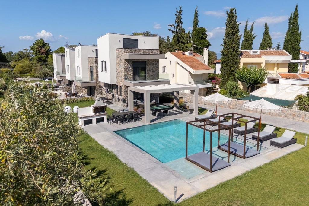 an aerial view of a villa with a swimming pool at My Sea Lodge - Glaros Complex in Pefkochori