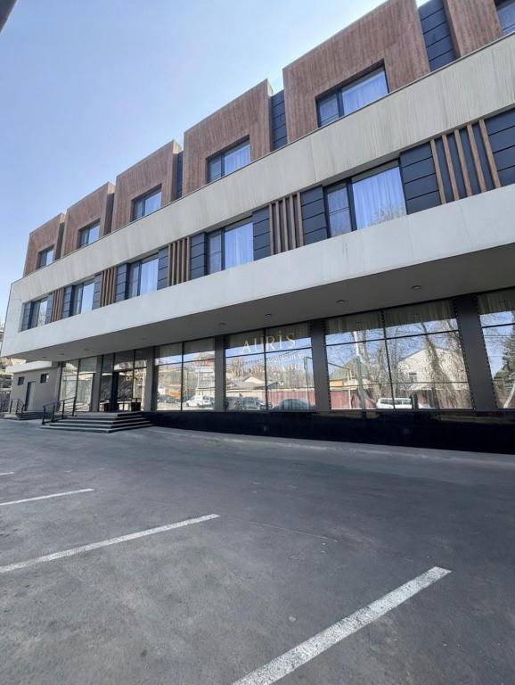 an empty parking lot in front of a building at Auris Hotel & Restobar in Almaty