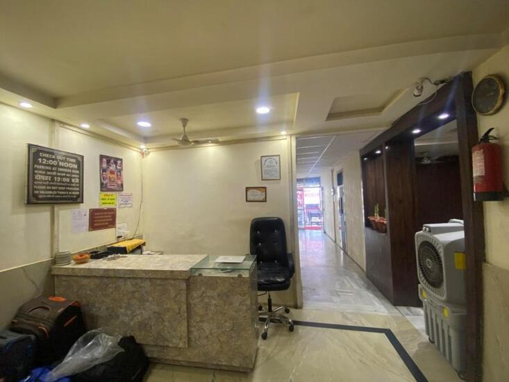 an office with a desk and a chair in a room at hotel shree krishna vaishnav in Agra