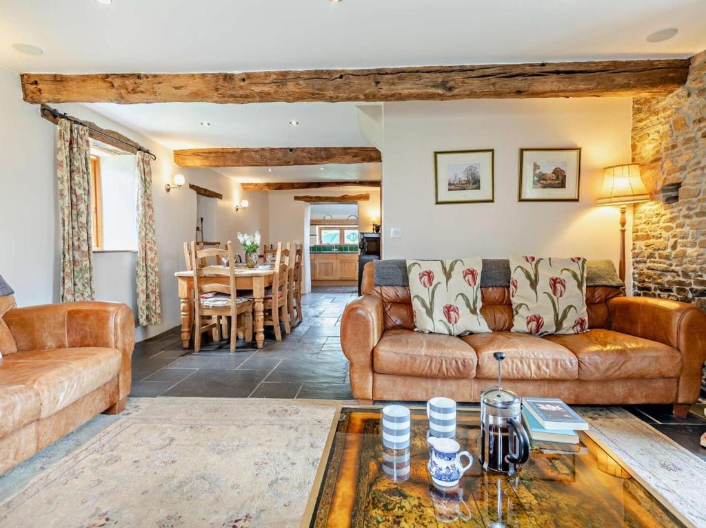 a living room with a couch and a table at 3 Bed in Winkleigh oc-1450b in Iddesleigh