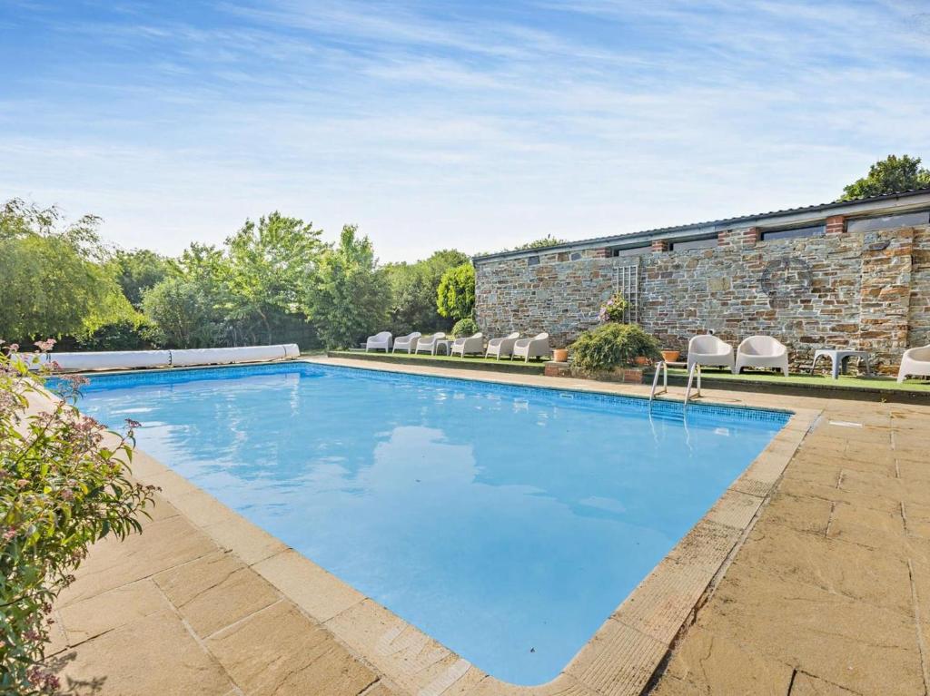 a large swimming pool in front of a building at 2 Bed in Bideford oc-60428 in Westward Ho