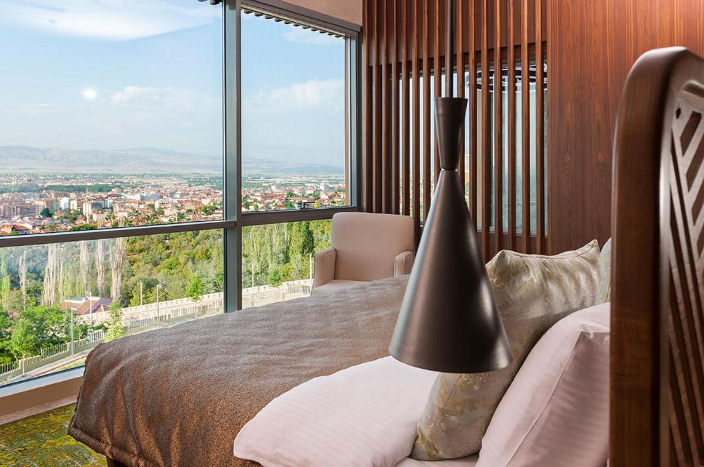Cama ou camas em um quarto em Tasigo Eskisehir