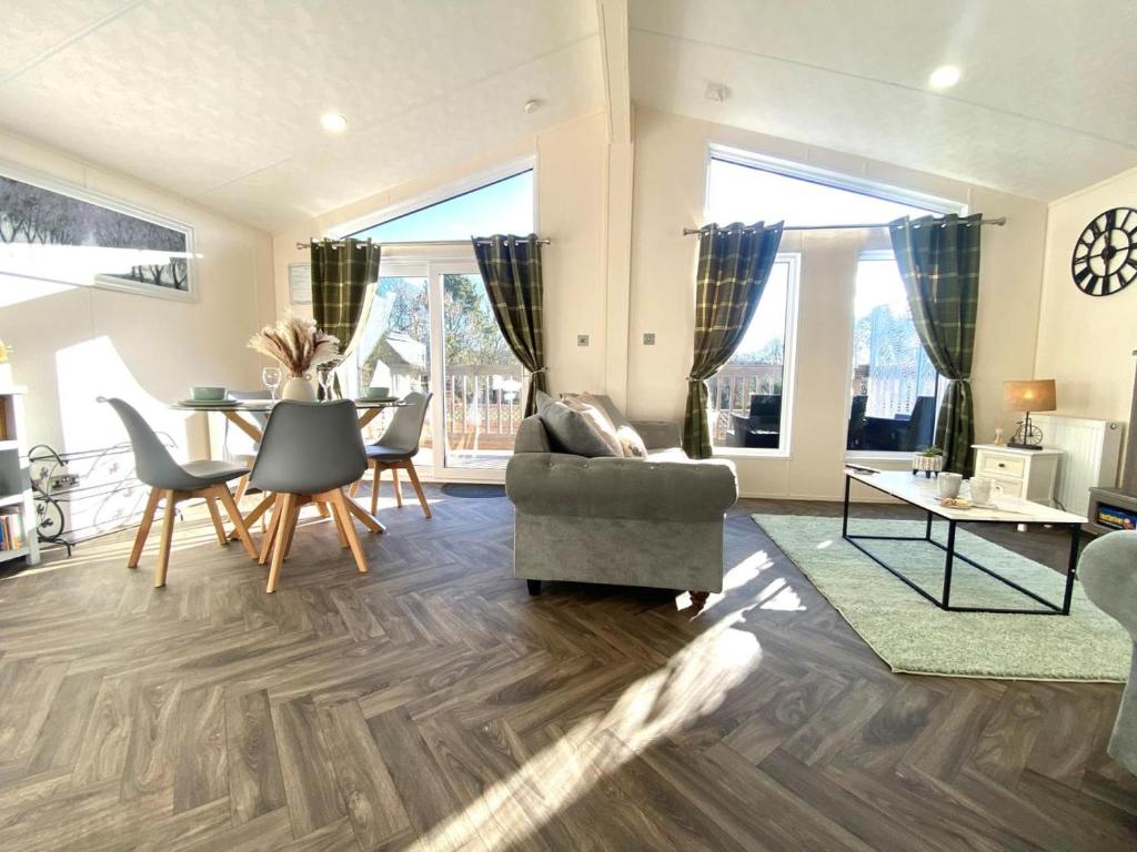 a living room with a couch and a table at 2 Bed in Honiton oc-76515 in Ottery Saint Mary