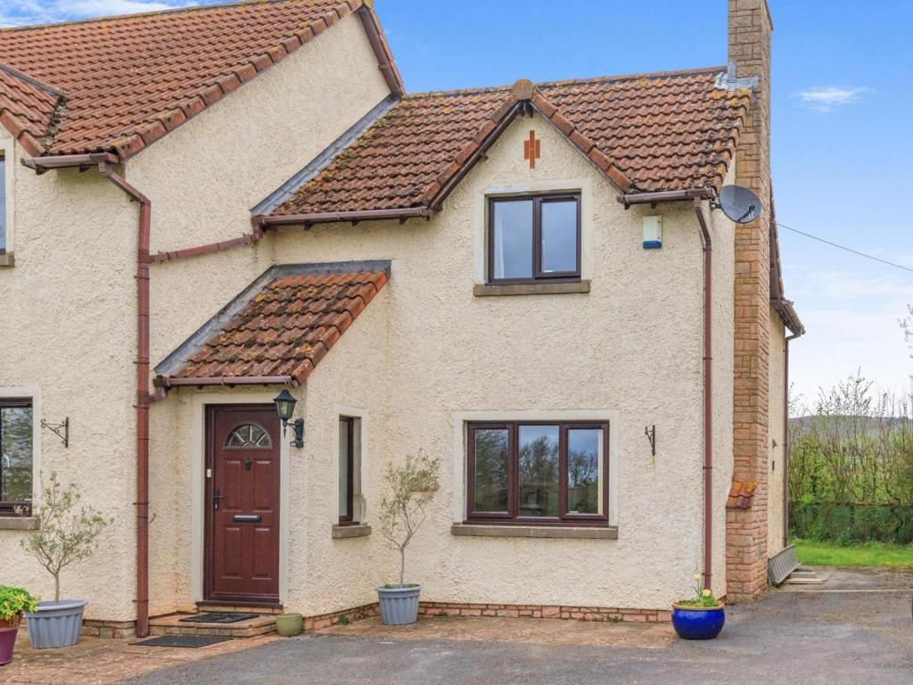 a brick house with a brown door and windows at 2 Bed in Taunton oc-41906 in Cothelstone