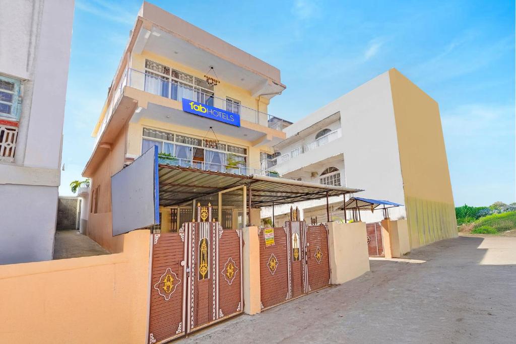 a building with a gate in front of it at FabHotel The Radium Inn in Rānchī