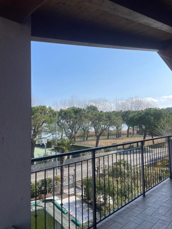 a balcony with a view of a park at Villa Aurora Apartments in Sirmione