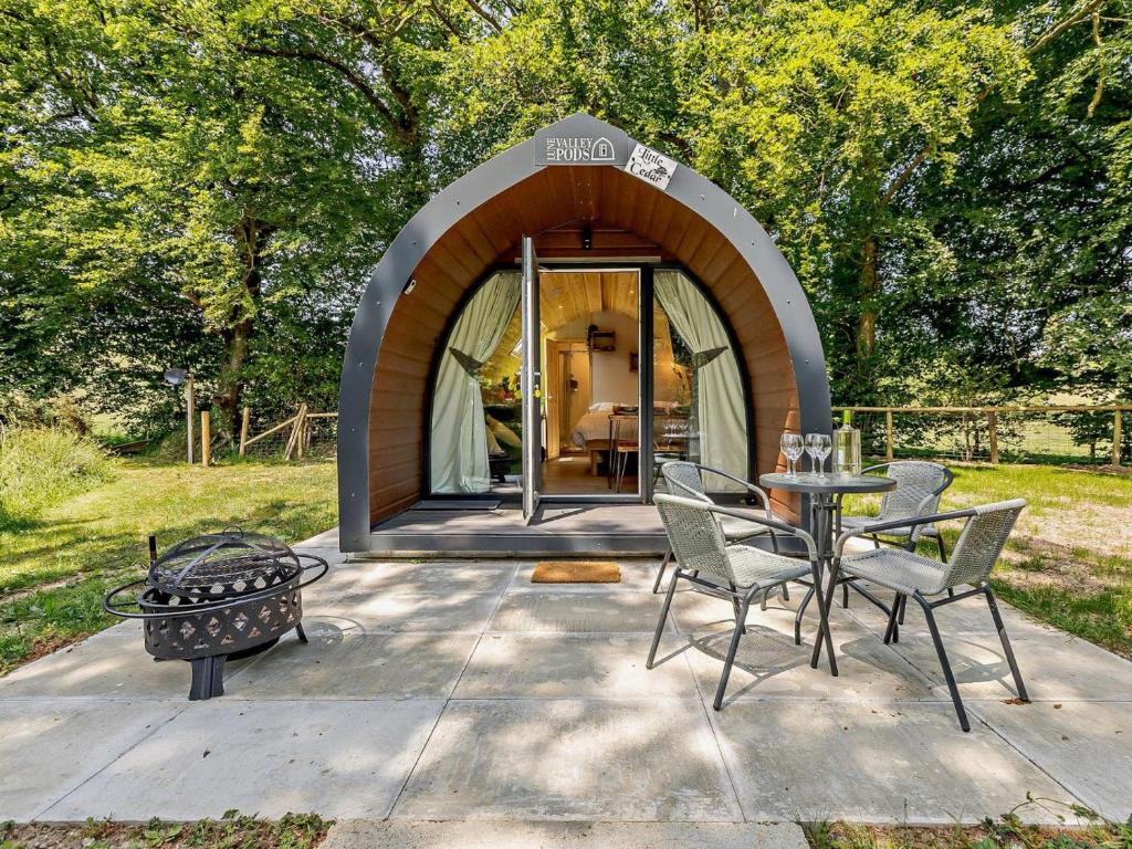 a circular house with a table and chairs on a patio at 2 Bed in Okehampton oc-92385 in Okehampton