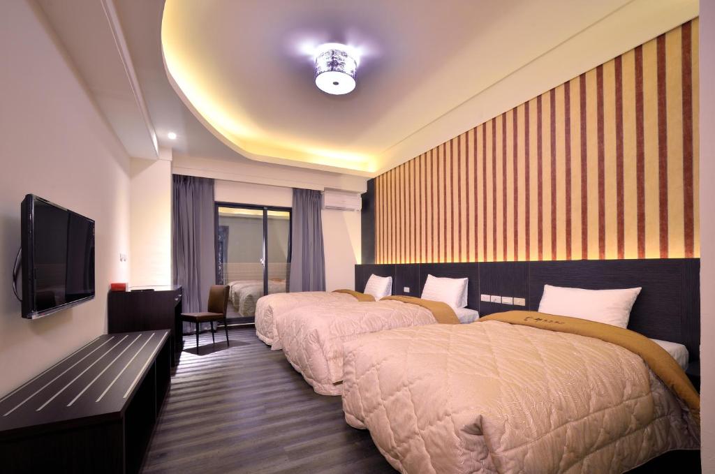 Postel nebo postele na pokoji v ubytování Yundu Business Hotel