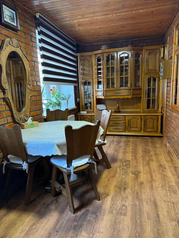 a dining room with a table and chairs at Bazar Apartment in Chişinău