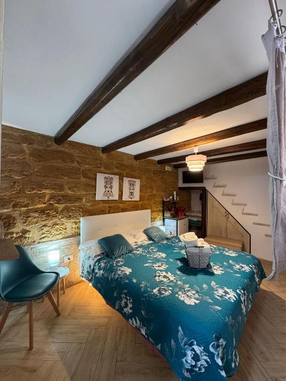 a bedroom with a bed and a chair in a room at b&b centro città in Agrigento