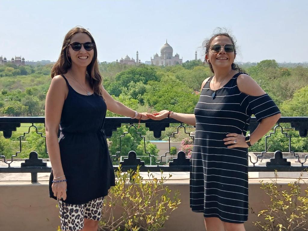 two women standing next to each other on a balcony at Hotel Taj Plaza, Just a 5-minute walk from the Taj Mahal 600 meters in Agra