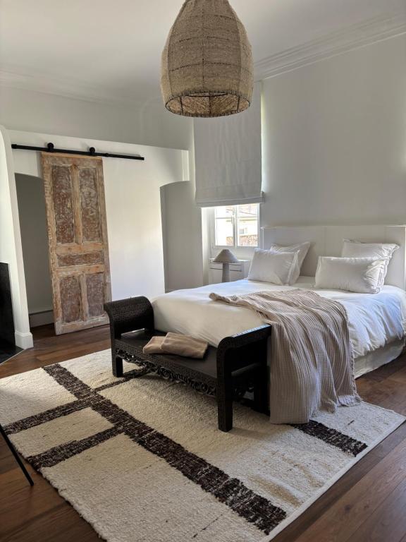 a bedroom with a large bed and a rug at A Casa Di Rose in Ajaccio