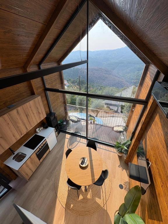 an overhead view of a living room with a large window at Casa de Sobreiros in Amarante