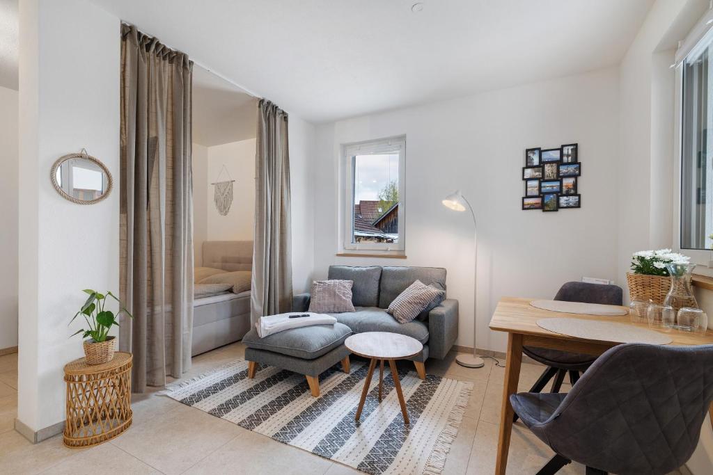 a living room with a couch and a table at Bodensee Apartment Lindau in Lindau