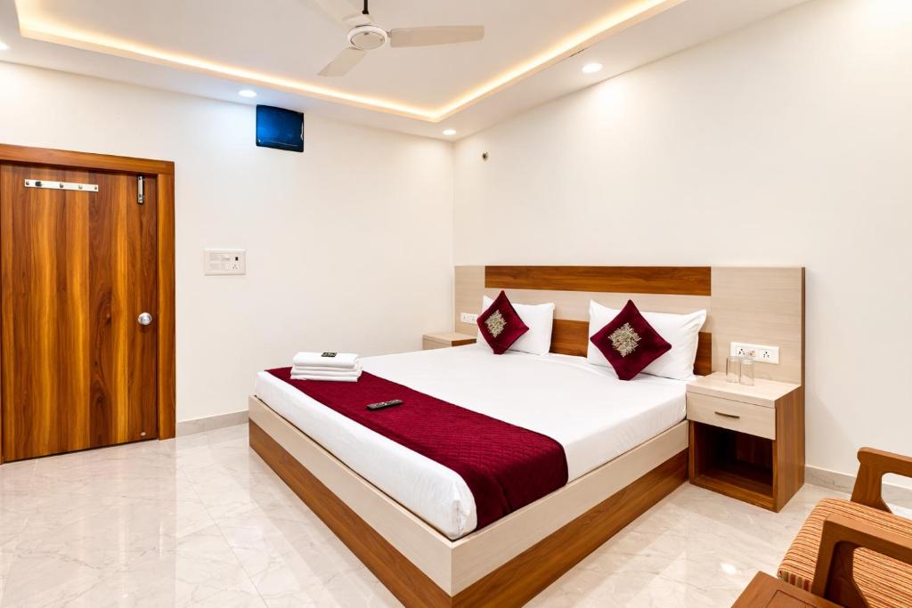 a bedroom with a large bed in a room at Premium-Ram-Krishna-Palace in Ayodhya