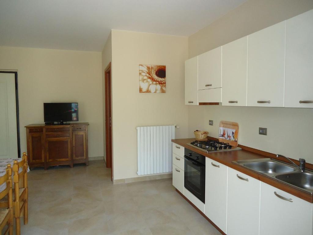 Kuchyň nebo kuchyňský kout v ubytování Villa Ninfea